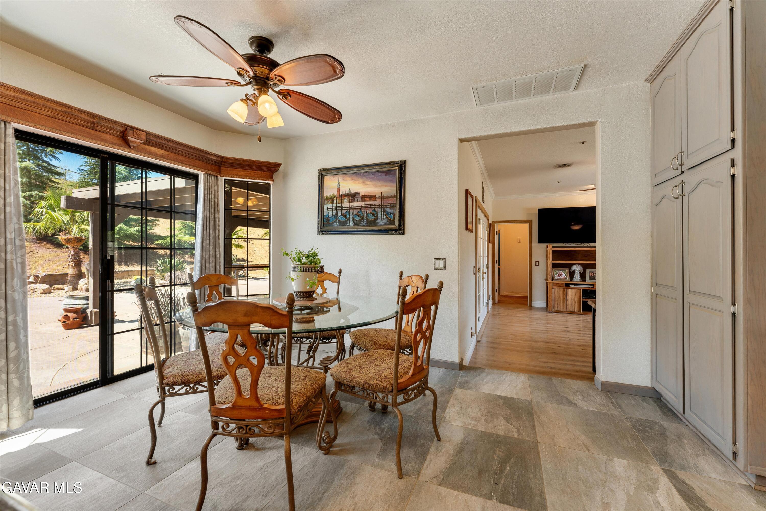 34625 Red Rover Mine Road Acton, CA 93510 - Photo 23 of 66 a view of a dining room with furniture window and wooden floor