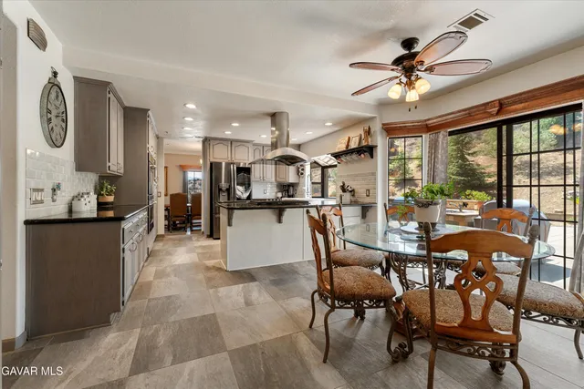 a spacious bathroom with a double vanity sink and a mirror