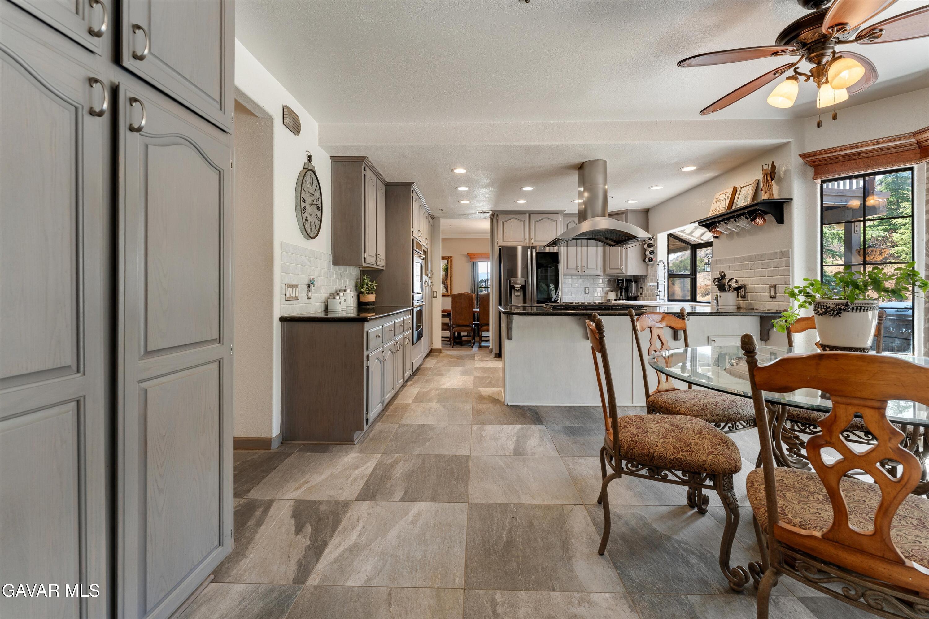 34625 Red Rover Mine Road Acton, CA 93510 - Photo 26 of 66 a living room with stainless steel appliances furniture a rug and a kitchen view