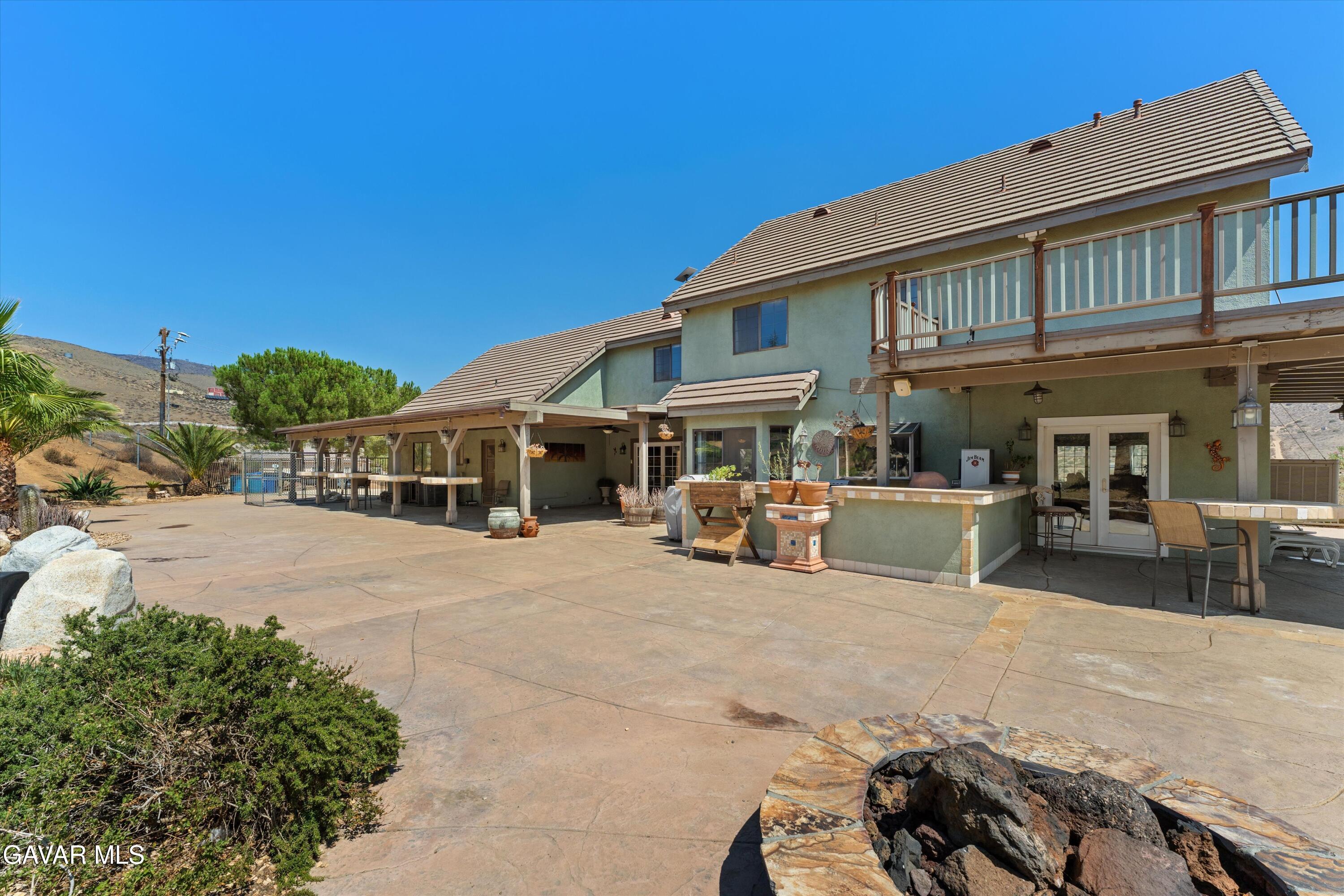 34625 Red Rover Mine Road Acton, CA 93510 - Photo 3 of 66 a view of a white house with swimming pool in front of it