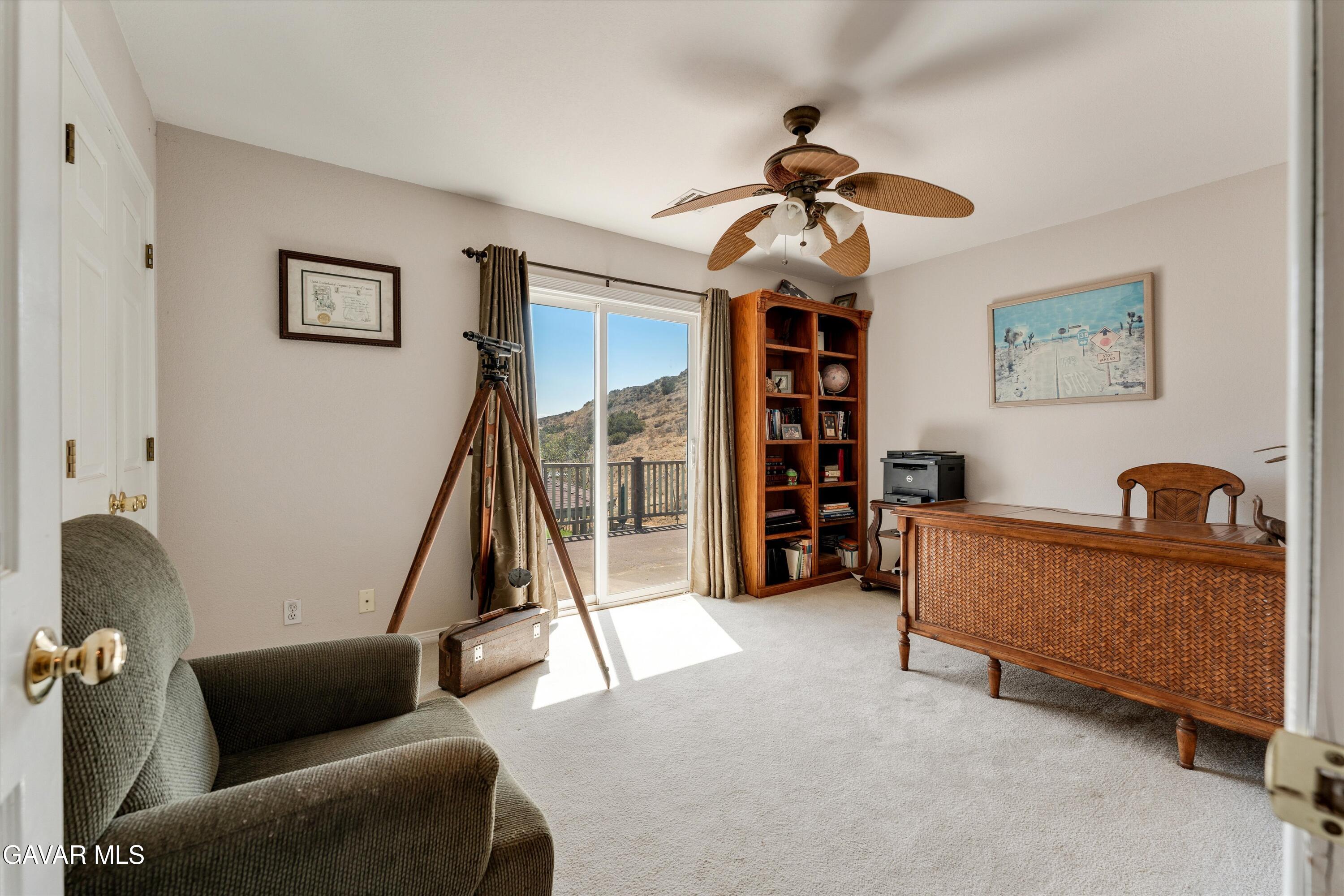 34625 Red Rover Mine Road Acton, CA 93510 - Photo 39 of 66 a living room with furniture and a gym machine