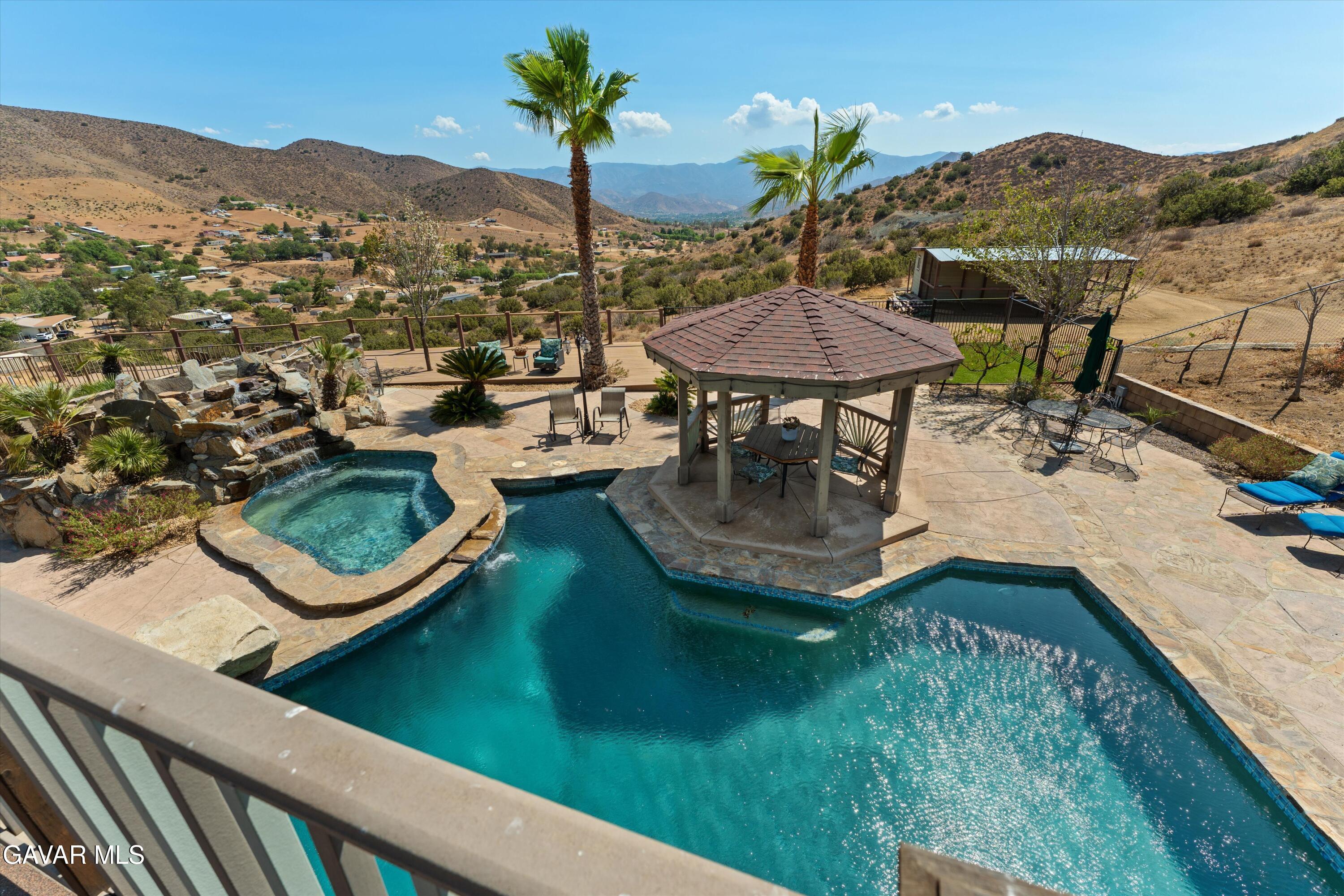 34625 Red Rover Mine Road Acton, CA 93510 - Photo 47 of 66 a view of a swimming pool with a patio