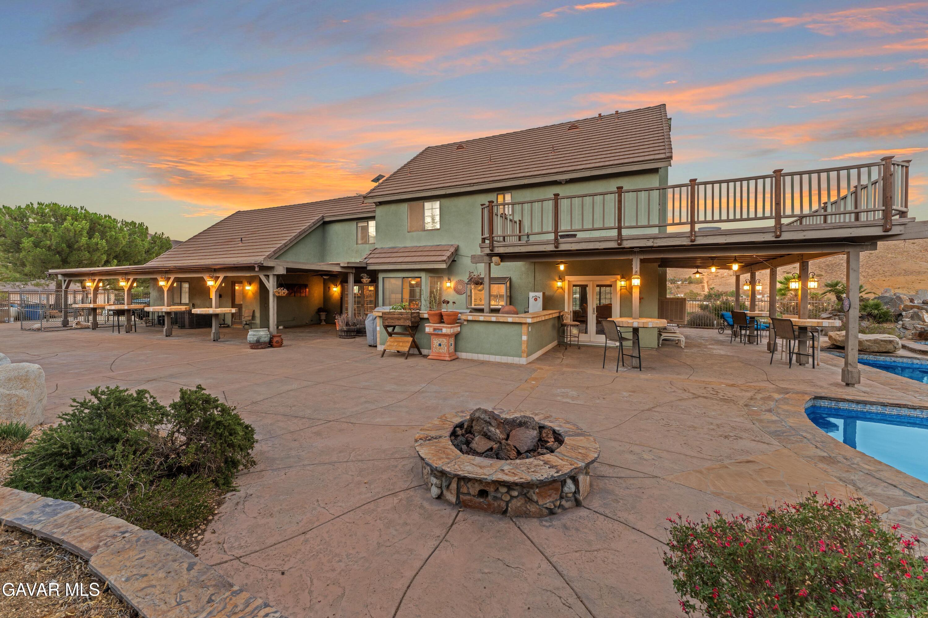34625 Red Rover Mine Road Acton, CA 93510 - Photo 51 of 66 a view of a patio with table and chairs potted plants and large tree