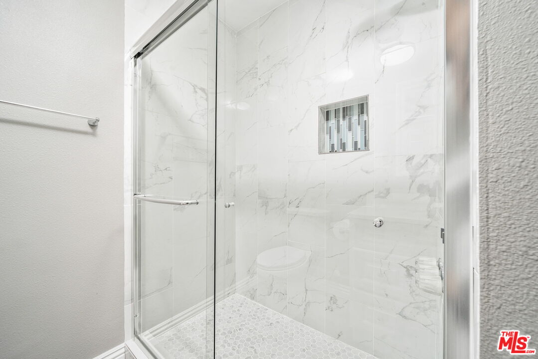 6860 Murray Street Riverside, CA 92504 - Photo 16 of 38 a bathroom with a shower