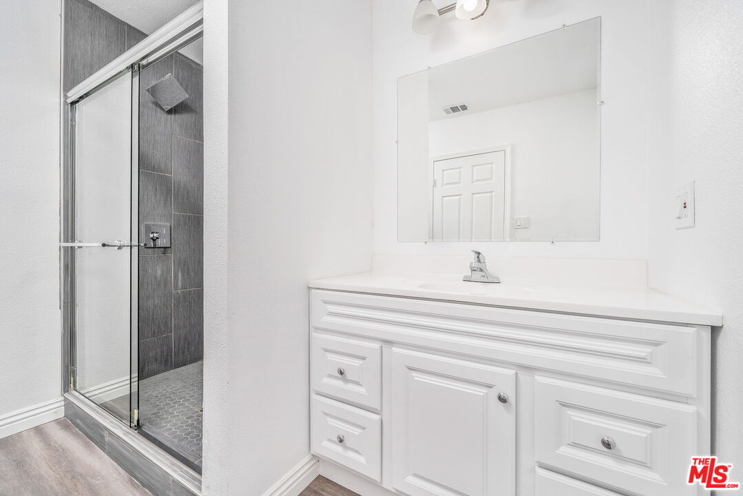 6860 Murray Street Riverside, CA 92504 - Photo 22 of 38 a bathroom with a sink and a mirror