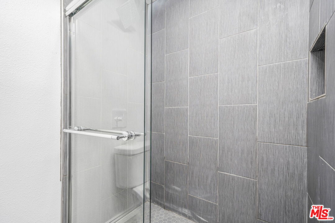 6860 Murray Street Riverside, CA 92504 - Photo 23 of 38 a bathroom with a shower