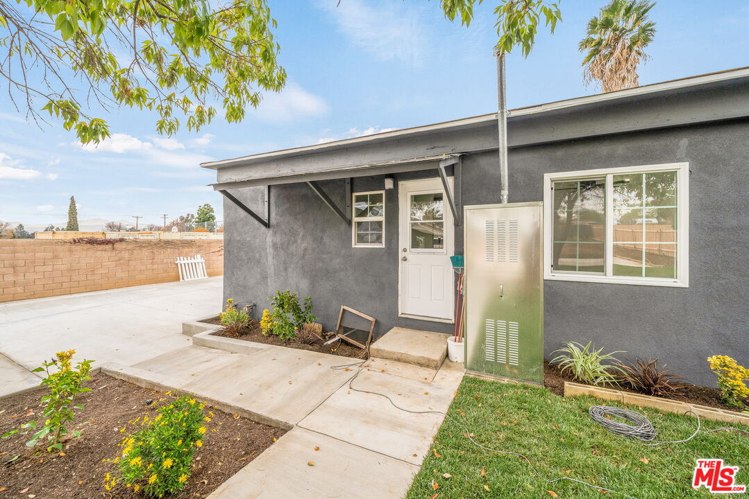 6860 Murray Street Riverside, CA 92504 - Photo 25 of 38 a front view of a house with a yard