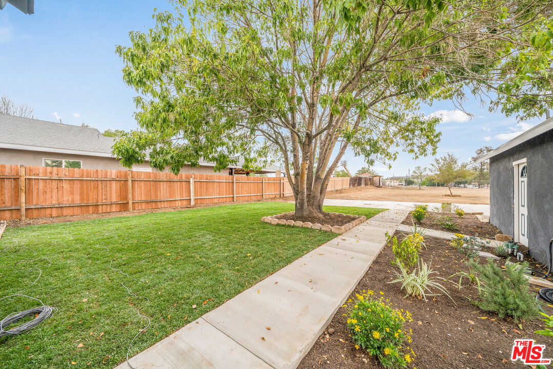 6860 Murray Street Riverside, CA 92504 - Photo 26 of 38 a view of a backyard with large trees