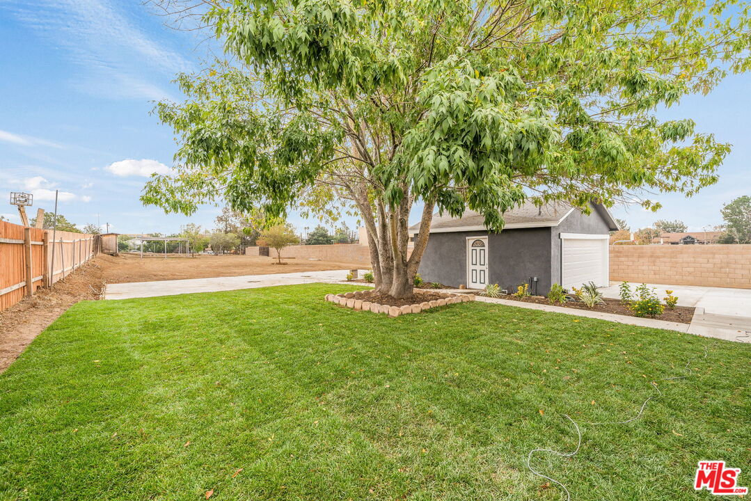 6860 Murray Street Riverside, CA 92504 - Photo 27 of 38 a view of backyard of house with green space