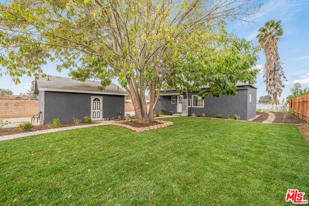 6860 Murray Street Riverside, CA 92504 - Photo 29 of 38 a front view of a house with a garden