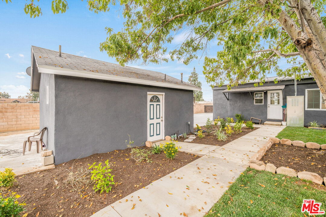 6860 Murray Street Riverside, CA 92504 - Photo 30 of 38 a front view of a house with a yard