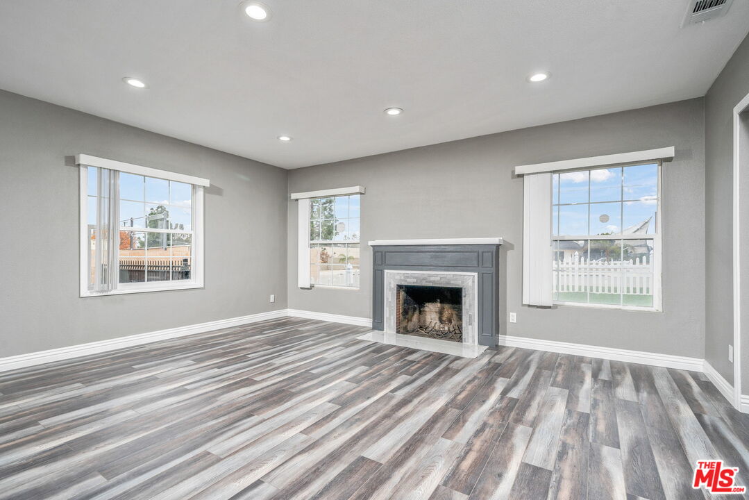 6860 Murray Street Riverside, CA 92504 - Photo 8 of 38 a view of empty room with window and fireplace