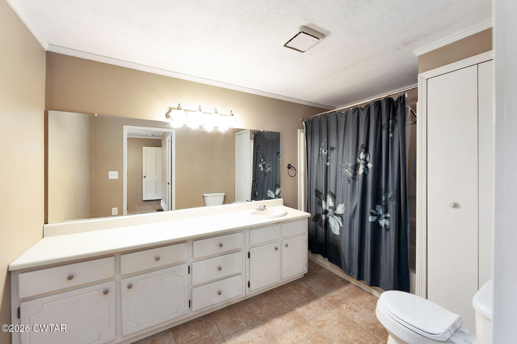 118 Radio Road Jackson, TN 38301 - Photo 16 of 22 a spacious bathroom with a double vanity sink toilet and shower