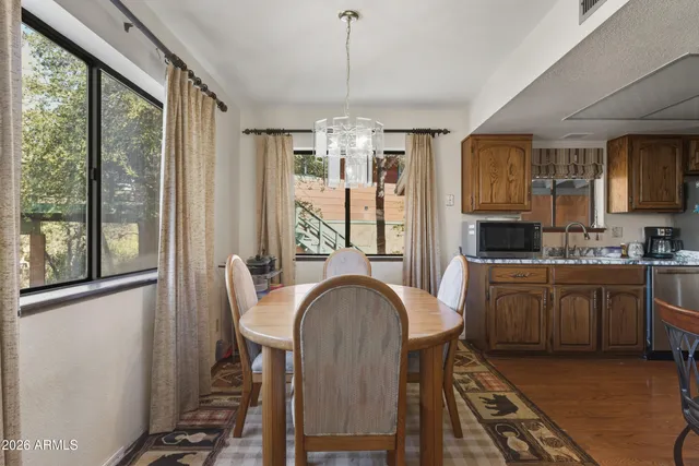 a view of a dining room with furniture window and outside view