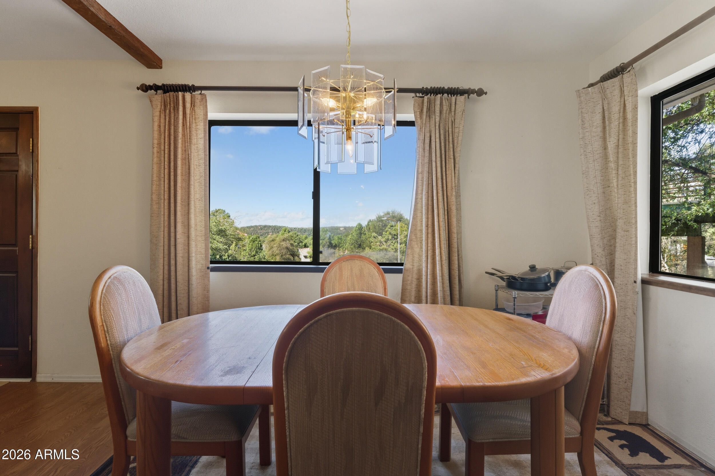 607 East Drowsey Circle Payson, AZ 85541 - Photo 12 of 33 a view of a dining room with furniture a chandelier and wooden floor