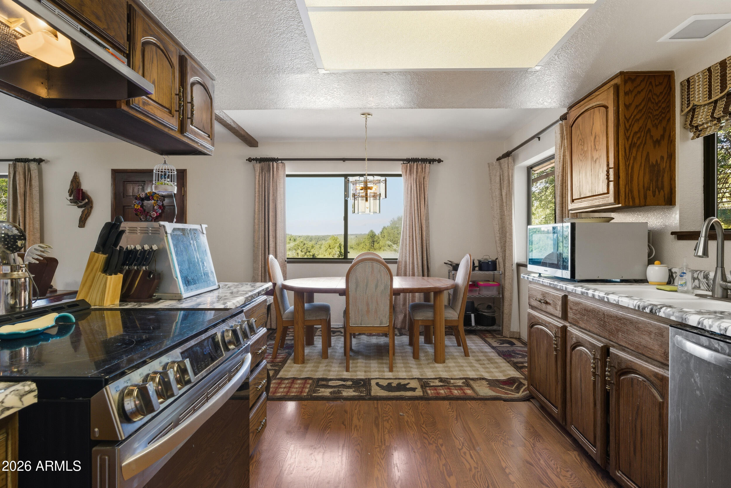 607 East Drowsey Circle Payson, AZ 85541 - Photo 15 of 33 a view of a kitchen with dining table and chairs