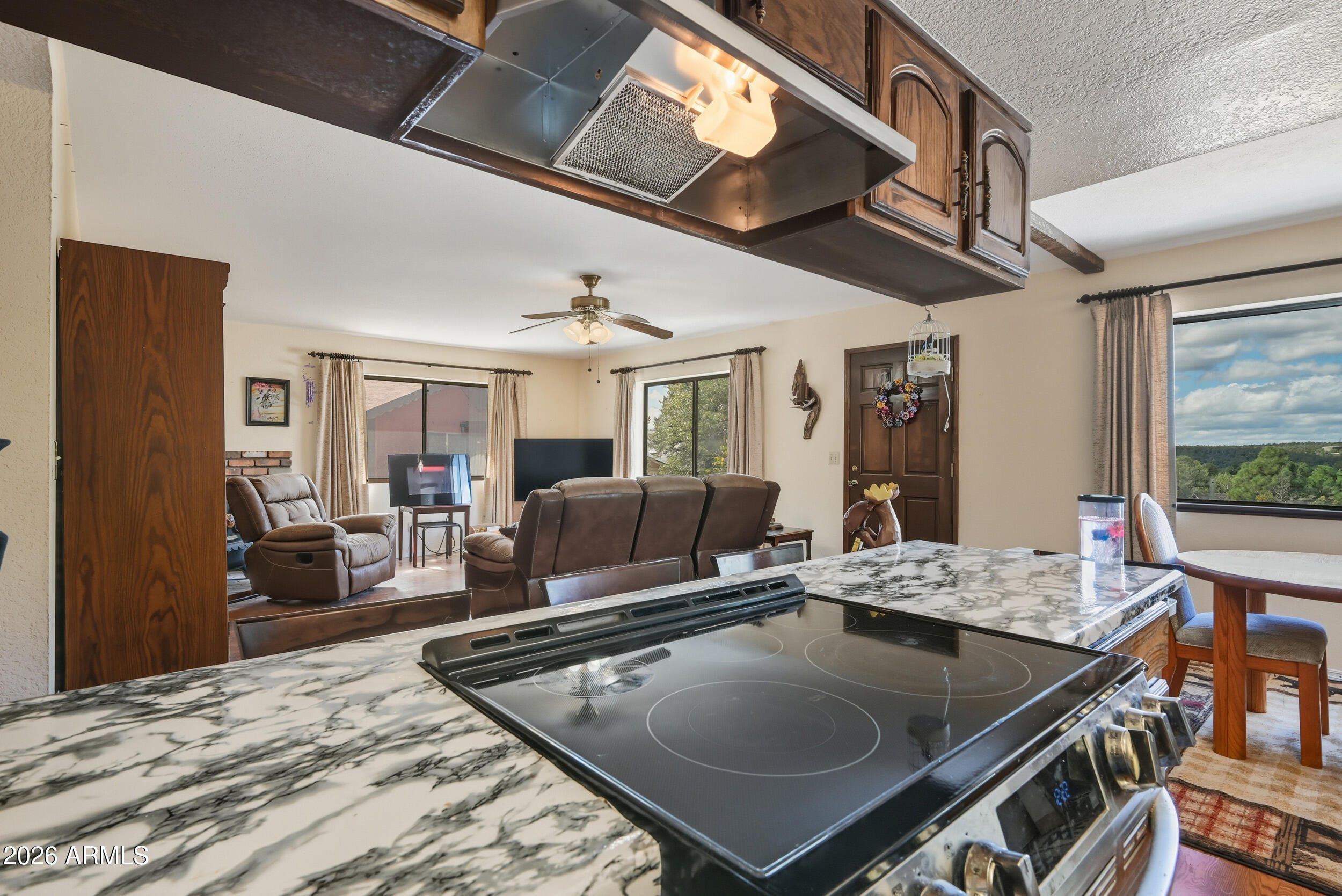 607 East Drowsey Circle Payson, AZ 85541 - Photo 16 of 33 a living room with furniture a flat screen tv and a table