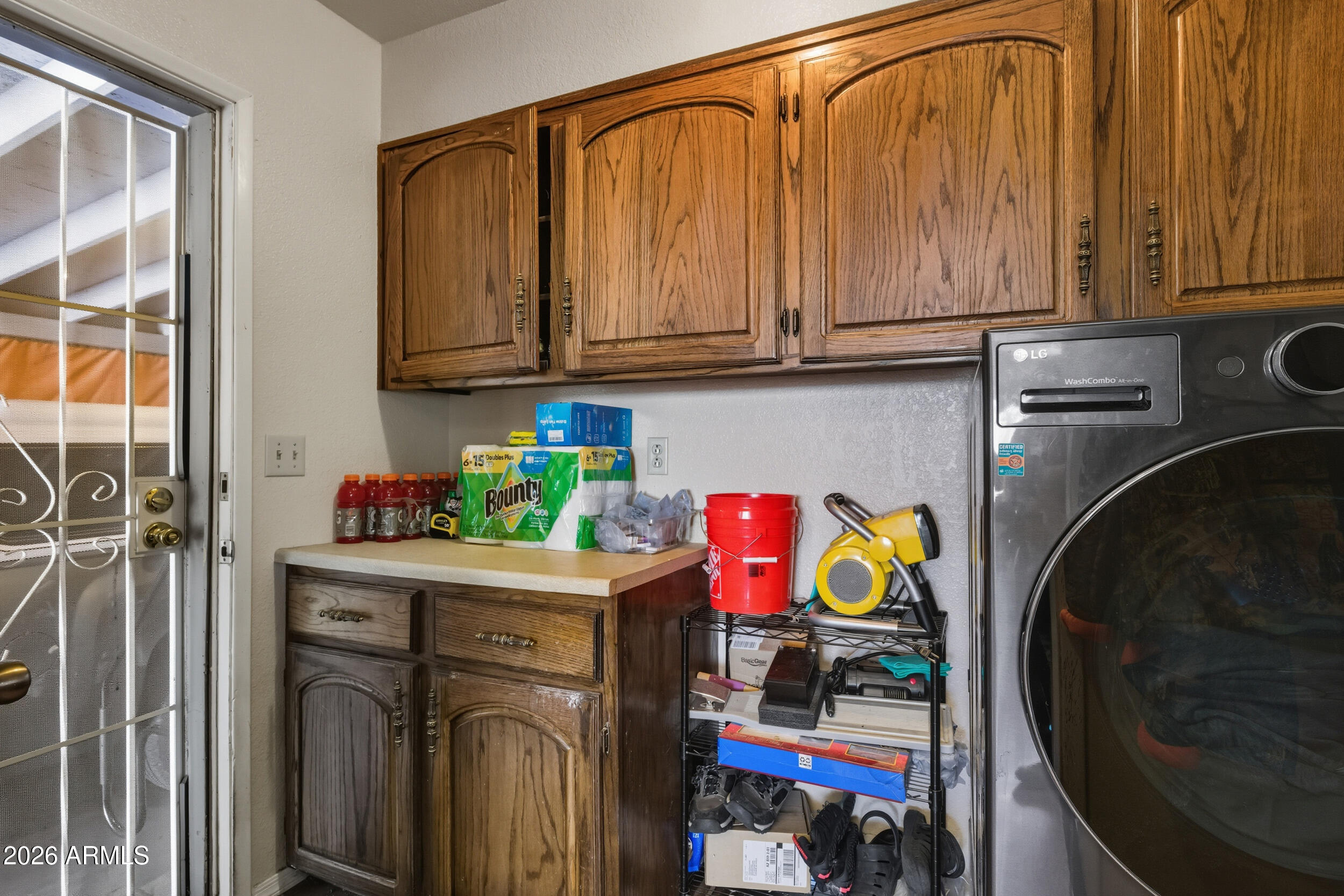 607 East Drowsey Circle Payson, AZ 85541 - Photo 18 of 33 a utility room with fridge and wooden floor