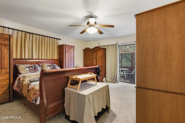 a bedroom with bed and a chandelier