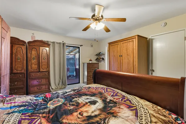 a bedroom with a bed dresser and a window