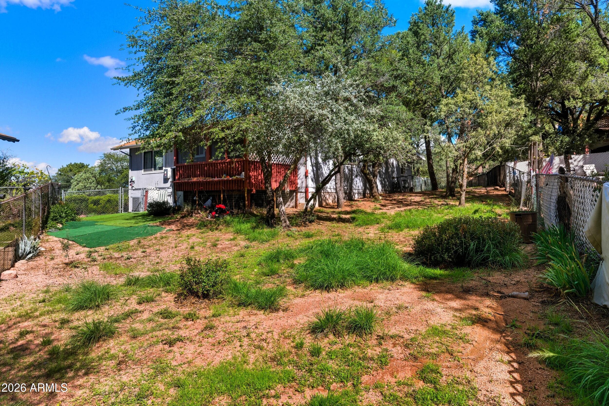 607 East Drowsey Circle Payson, AZ 85541 - Photo 31 of 33 a view of a backyard with plants and a slide
