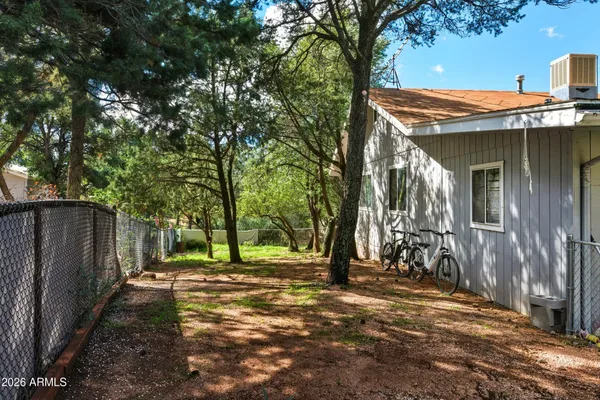 a view of outdoor space with deck and tree