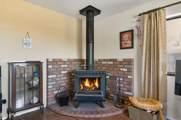 a living room with fireplace furniture and a fireplace