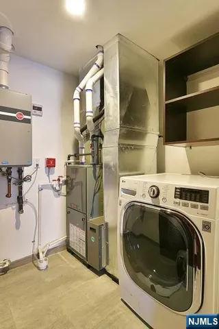 a view of a storage & utility room with washer and dryer