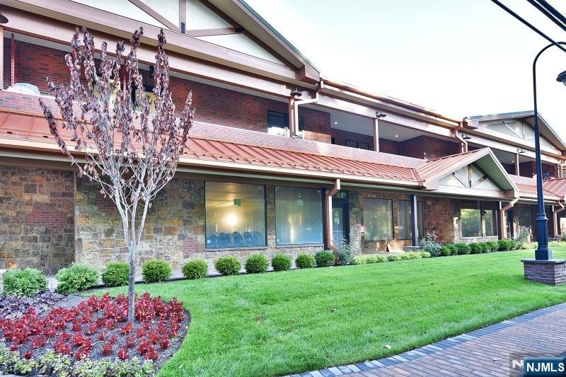 8-10 Whitehall Road, Unit 3 Towaco, NJ 07082 - Photo 12 of 12 a front view of a house with garden