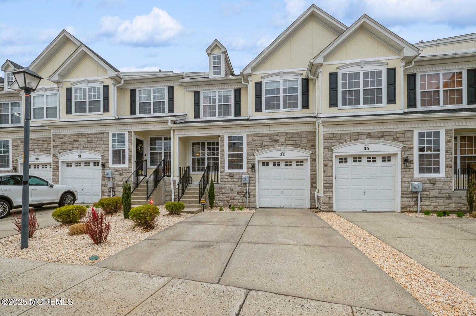 a view of a brick house with many windows