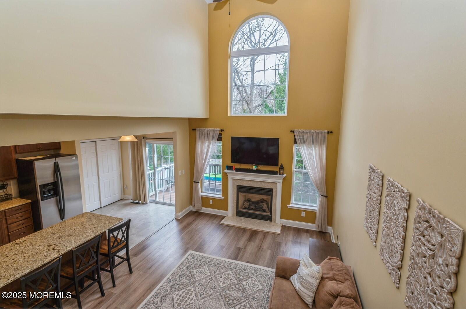 33 Brookfield Drive Jackson, NJ 08527 - Photo 11 of 23 a living room with furniture a window and a flat screen tv