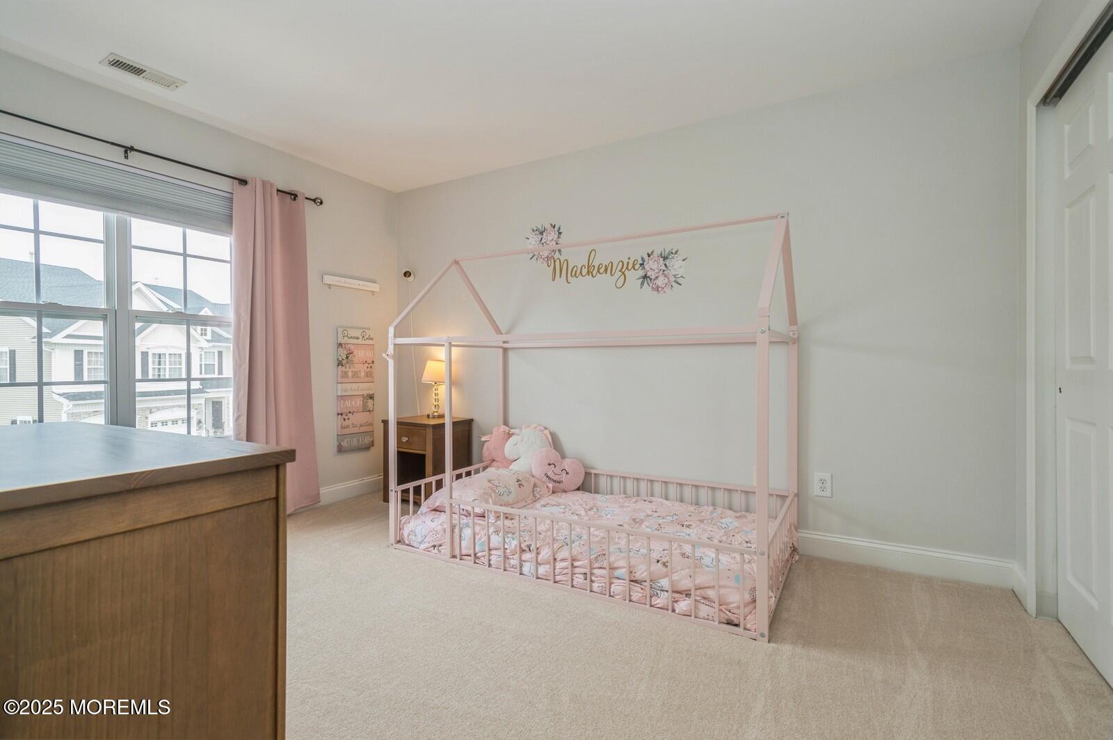 33 Brookfield Drive Jackson, NJ 08527 - Photo 16 of 23 a bedroom with a large bed and a window