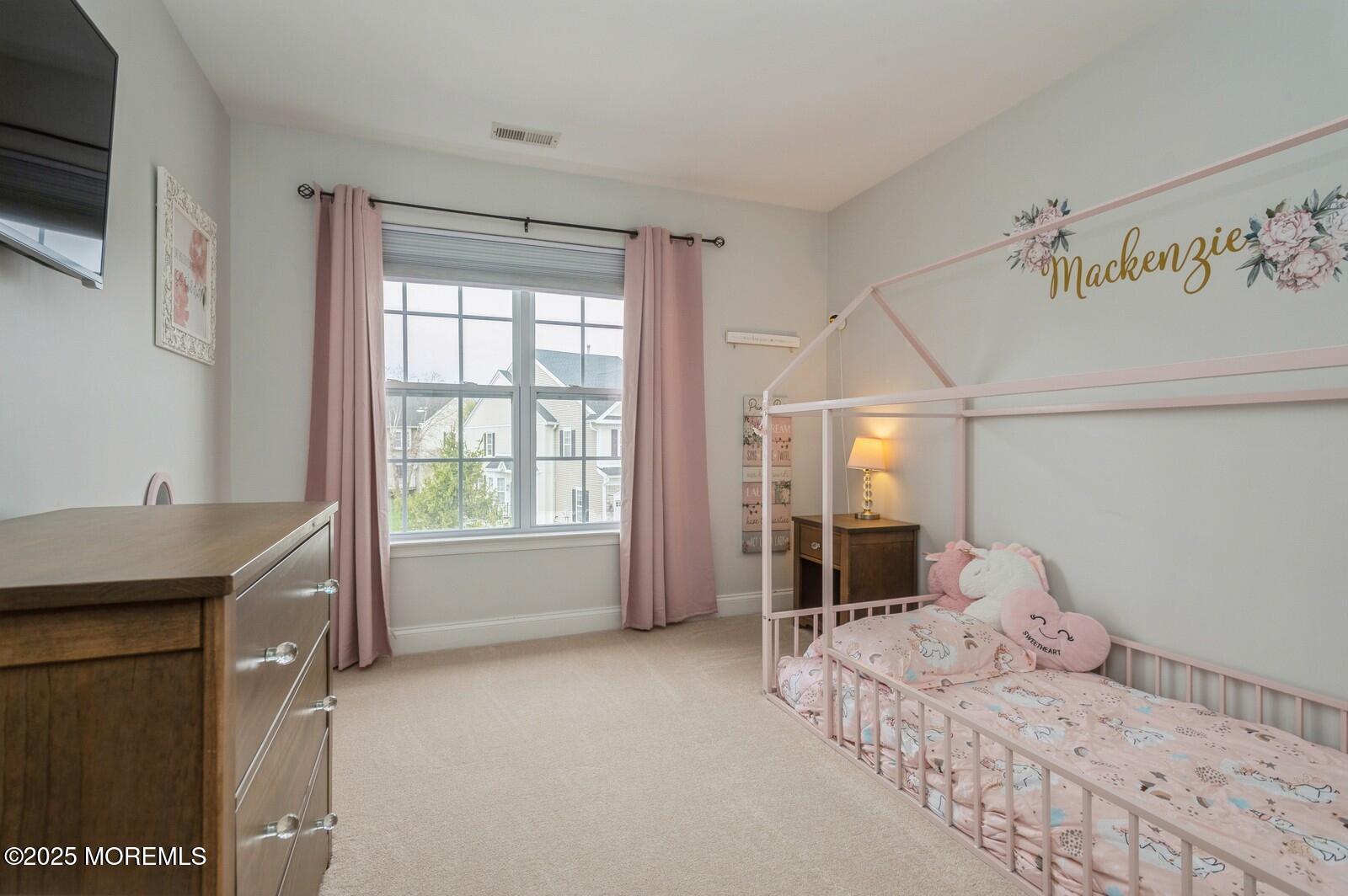 33 Brookfield Drive Jackson, NJ 08527 - Photo 17 of 23 a bedroom with a bed and a window