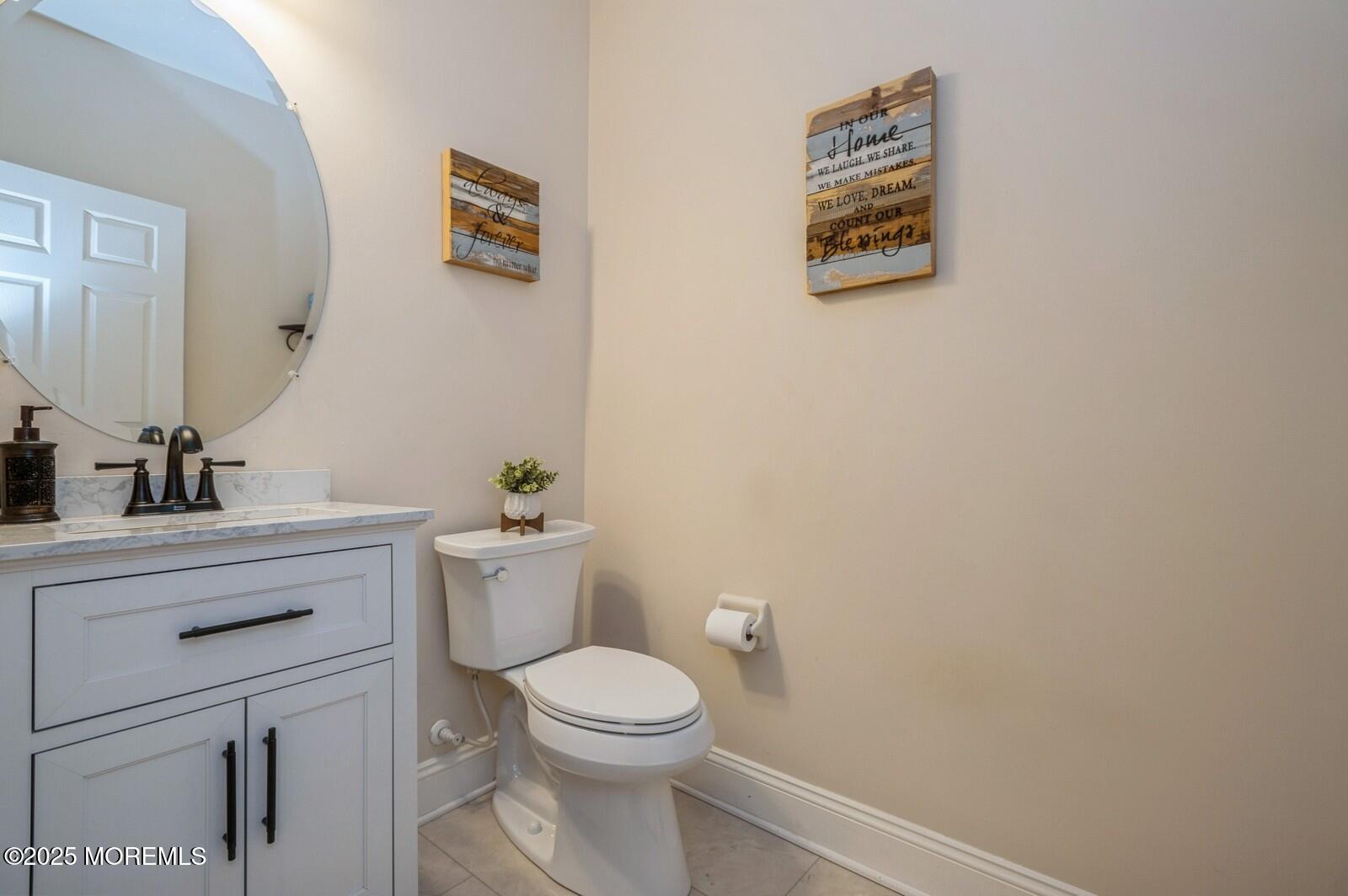33 Brookfield Drive Jackson, NJ 08527 - Photo 21 of 23 a bathroom with a toilet a sink and mirror