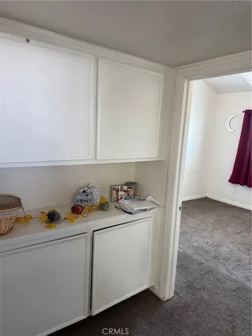 a utility room with two washing machine