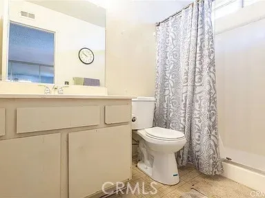 a bathroom with a toilet and a sink