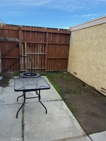 a view of a backyard with furniture