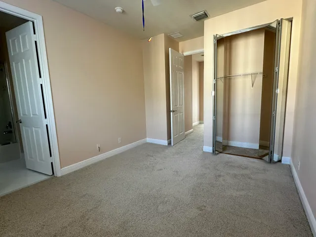 an empty room with a mirror