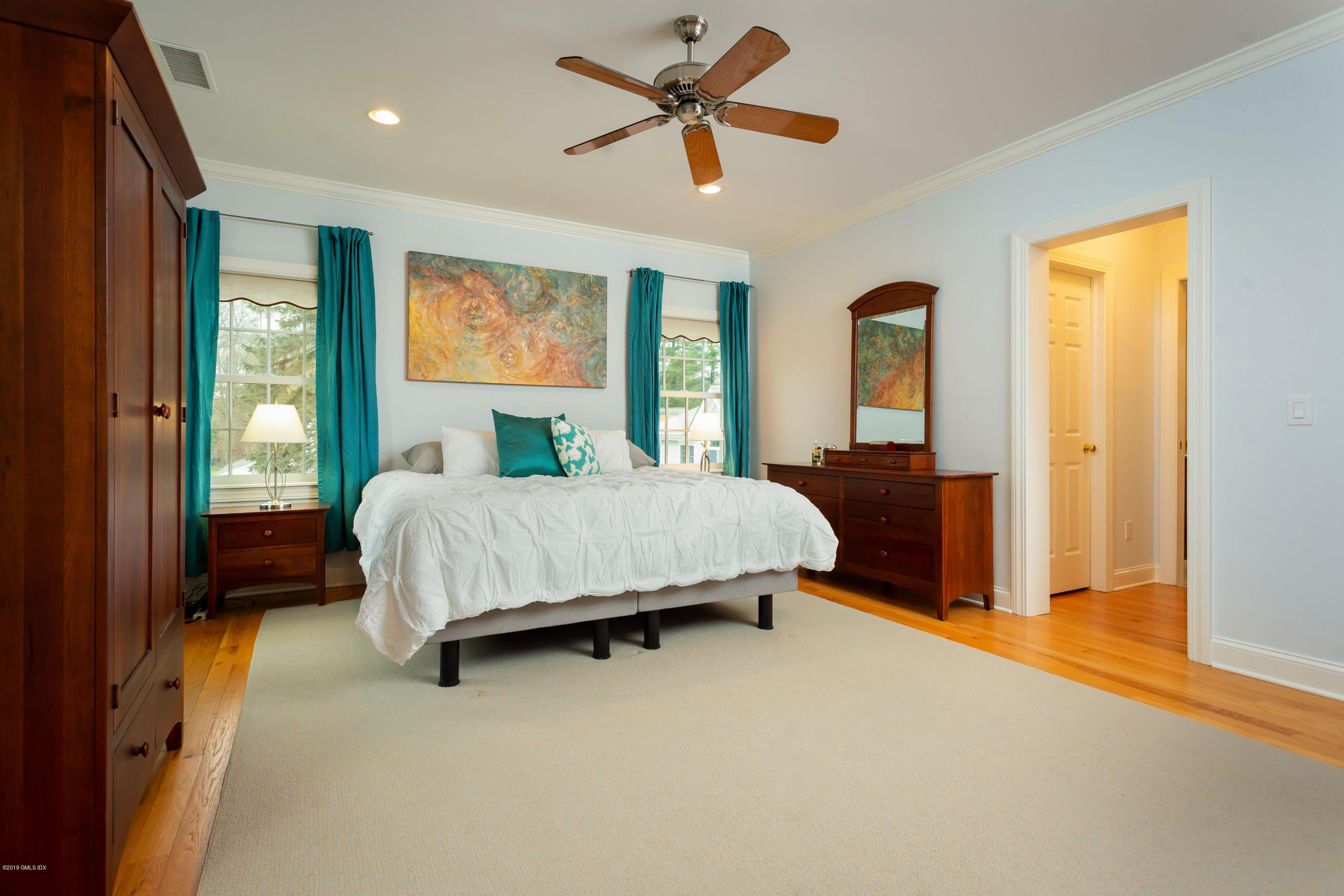 11 Tory Road Riverside, CT 06878 - Photo 15 of 29 a bedroom with a bed and large windows