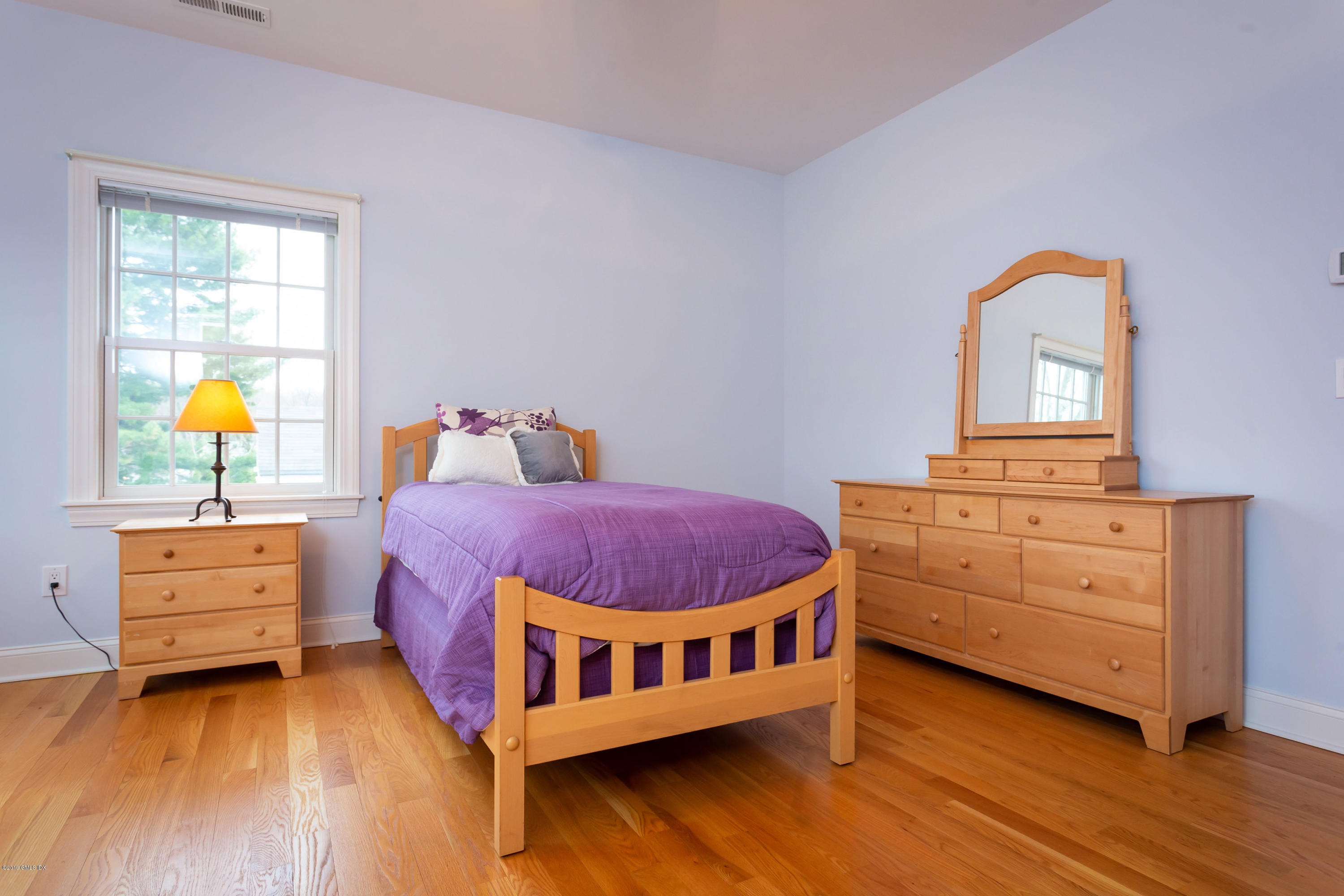 11 Tory Road Riverside, CT 06878 - Photo 19 of 29 a spacious bedroom with a bed and wooden floor
