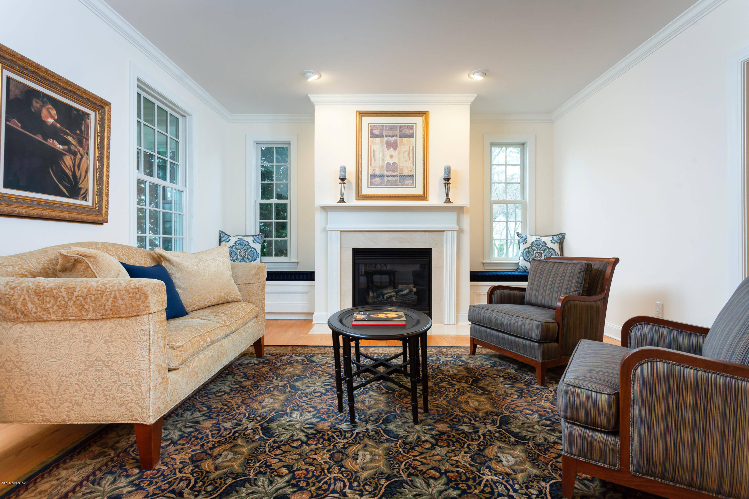 11 Tory Road Riverside, CT 06878 - Photo 4 of 29 a living room with furniture a fireplace and a window