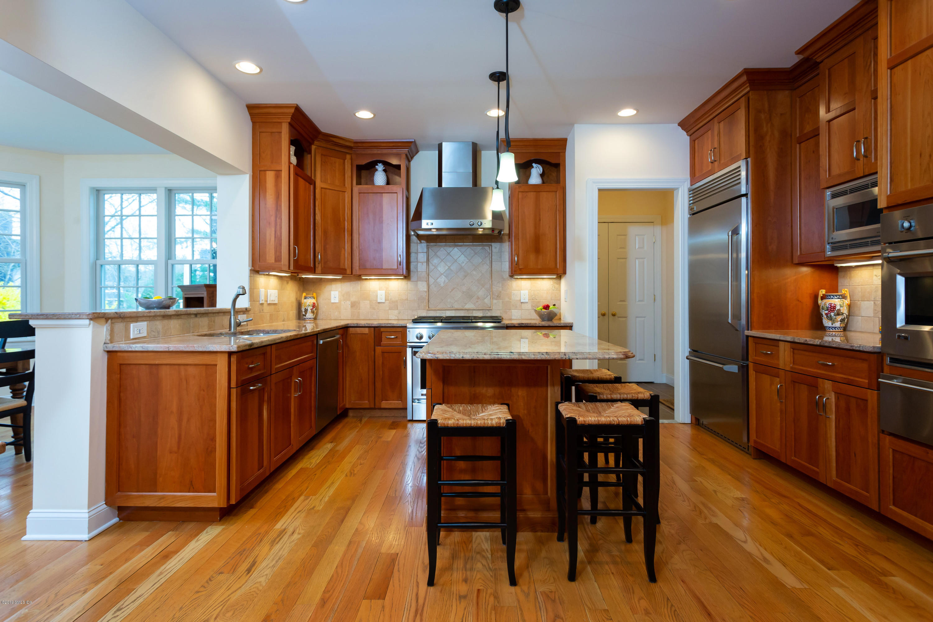 11 Tory Road Riverside, CT 06878 - Photo 10 of 29 a kitchen with stainless steel appliances granite countertop wooden floors stove and cabinets