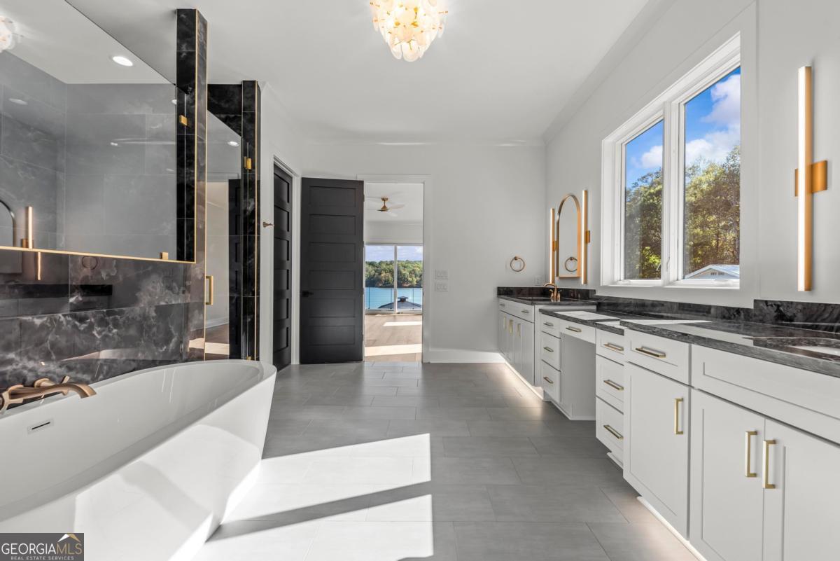 1089 B Crooked Creek Road Eatonton, GA 31024 - Photo 27 of 74 a large white kitchen with a large window
