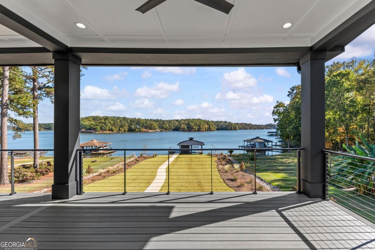 1089 B Crooked Creek Road Eatonton, GA 31024 - Photo 29 of 74 a view of a living room and floor to ceiling window or wooden floor