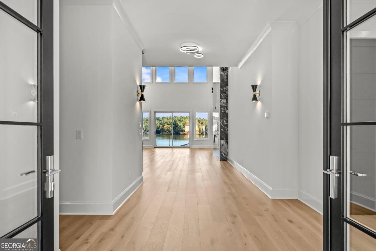 1089 B Crooked Creek Road Eatonton, GA 31024 - Photo 3 of 74 a view of hallway with wooden floor