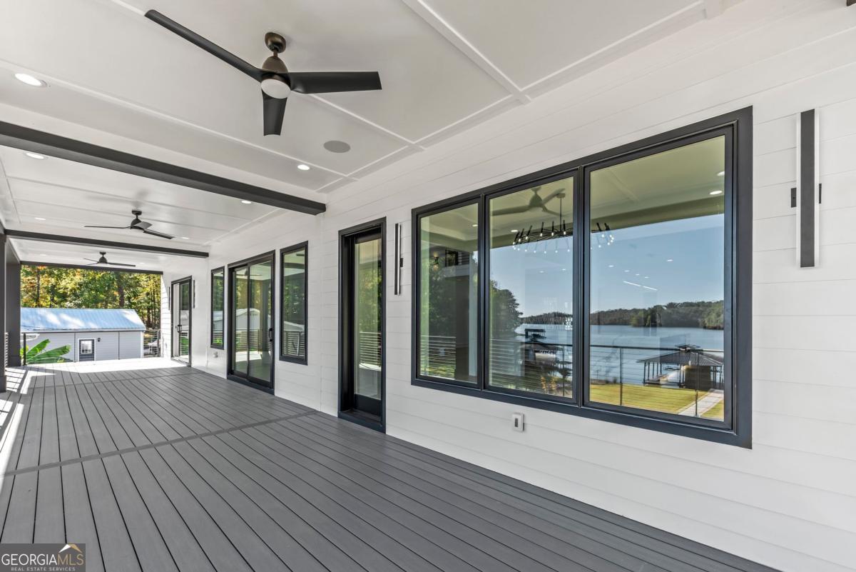 1089 B Crooked Creek Road Eatonton, GA 31024 - Photo 31 of 74 a view of a porch with wooden floor and outdoor space