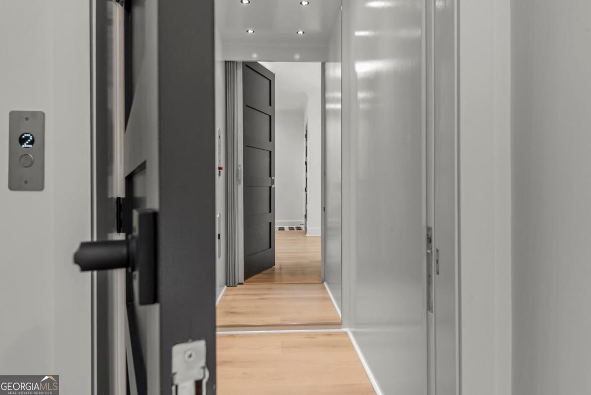 1089 B Crooked Creek Road Eatonton, GA 31024 - Photo 4 of 74 a view of a hallway with wooden floor and staircase
