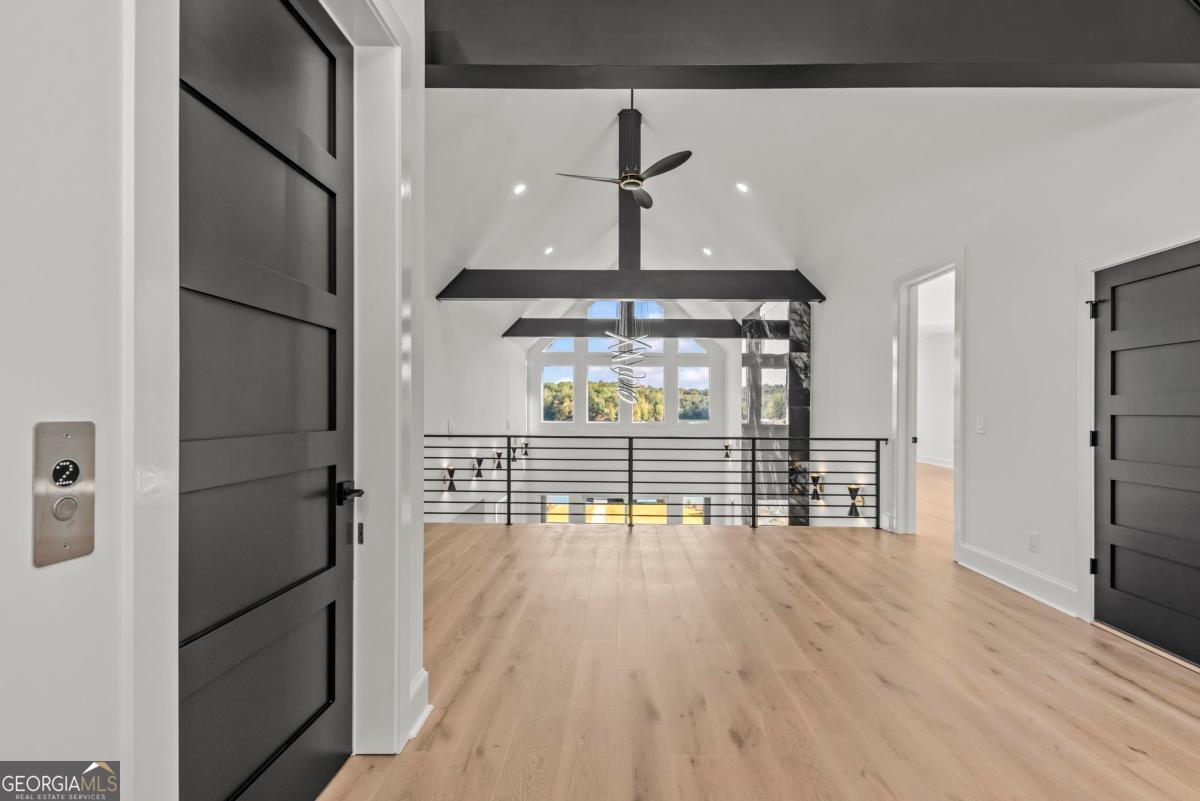 1089 B Crooked Creek Road Eatonton, GA 31024 - Photo 47 of 74 a view of empty room with wooden floor