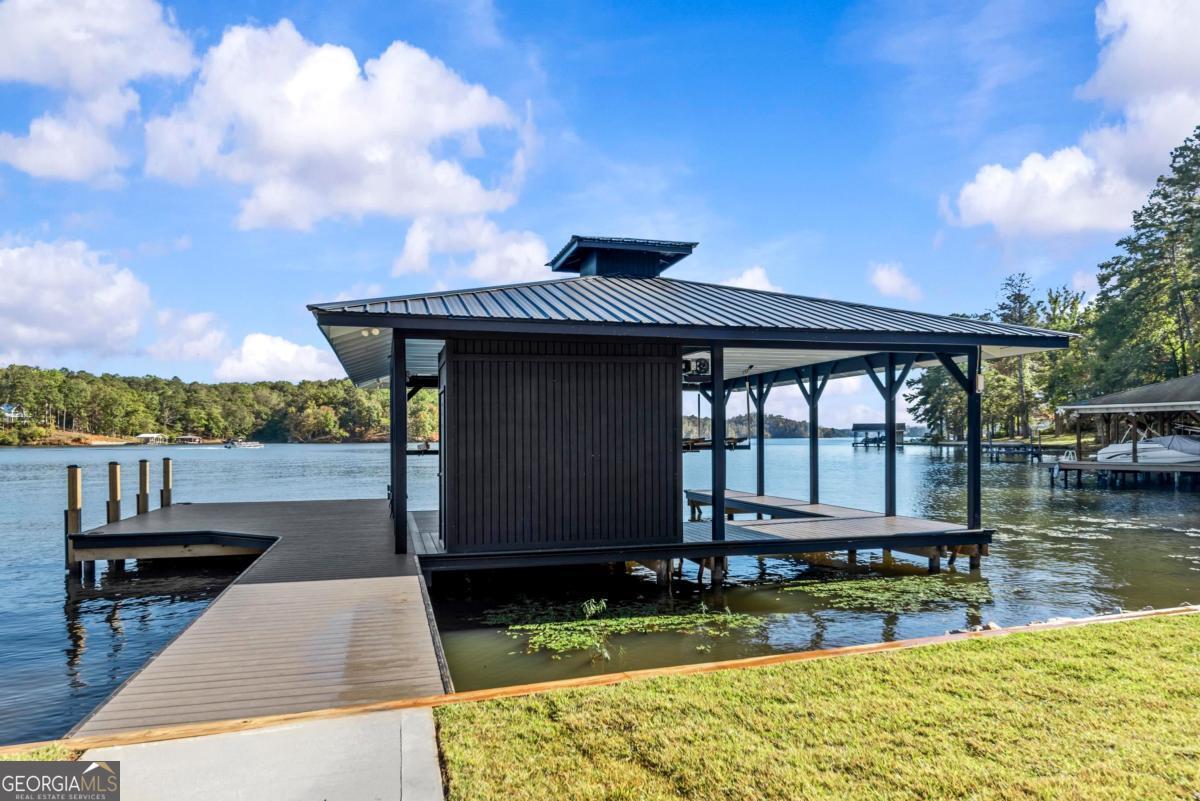 1089 B Crooked Creek Road Eatonton, GA 31024 - Photo 64 of 74 a view of a house with wooden deck