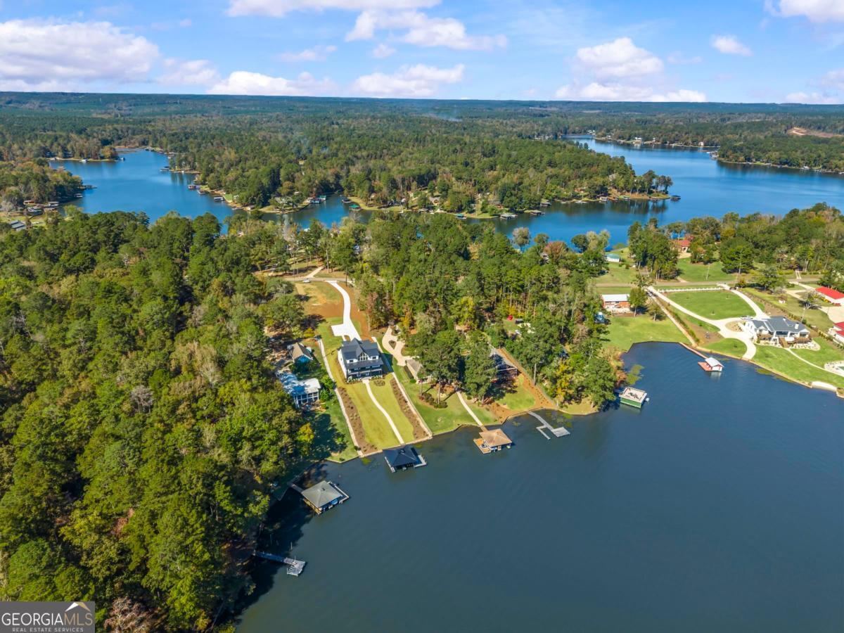 1089 B Crooked Creek Road Eatonton, GA 31024 - Photo 71 of 74 an aerial view of residential houses with outdoor space and lake view